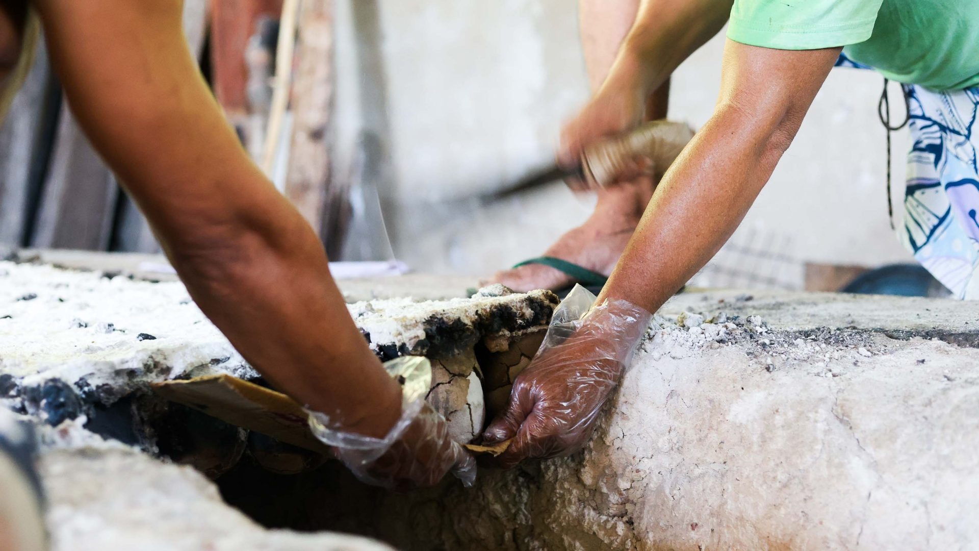 Hands pull salt out carefully.