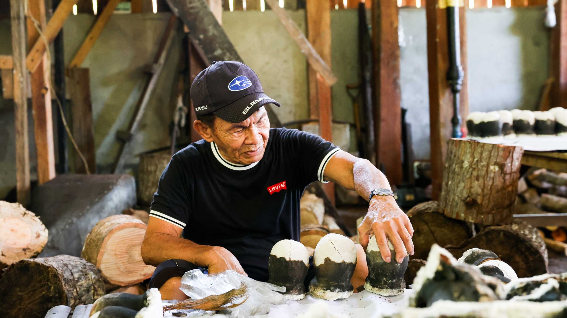 A man carefully handles some salt.