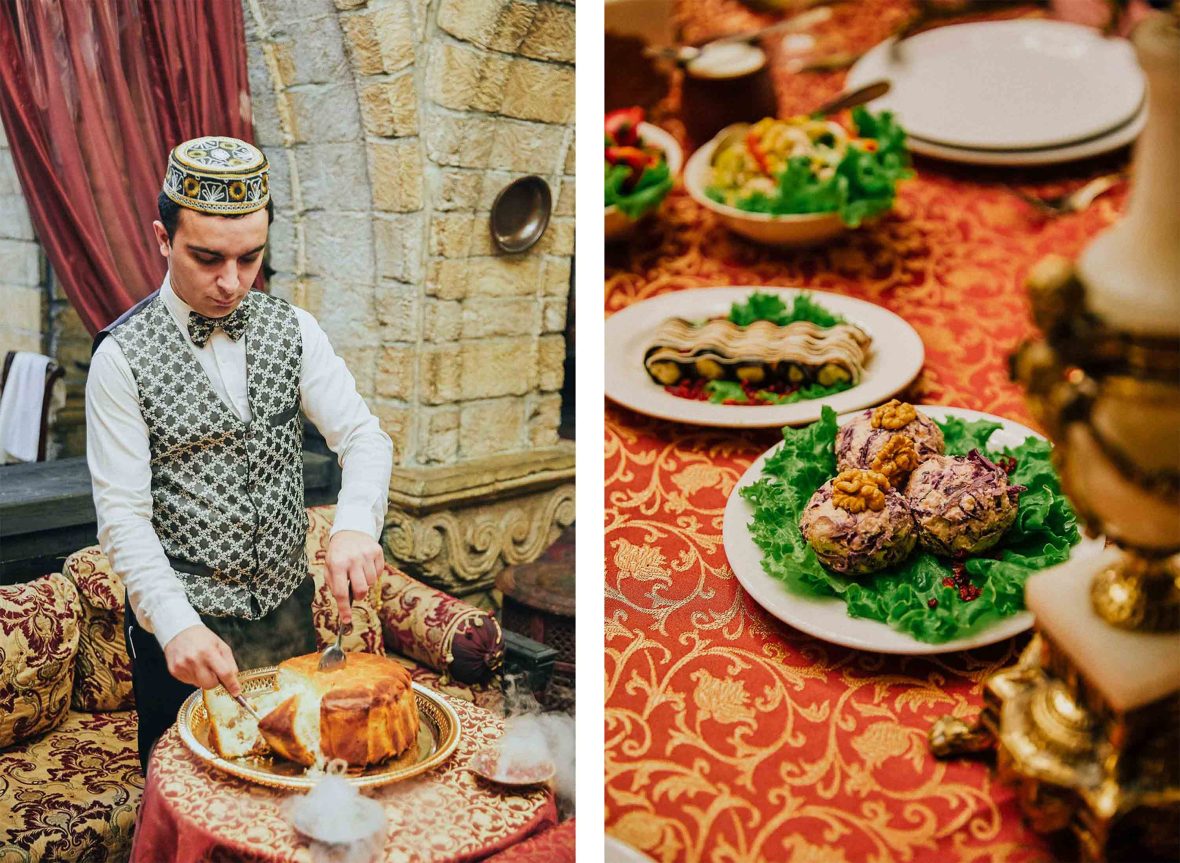 A man serves up plates of local food.