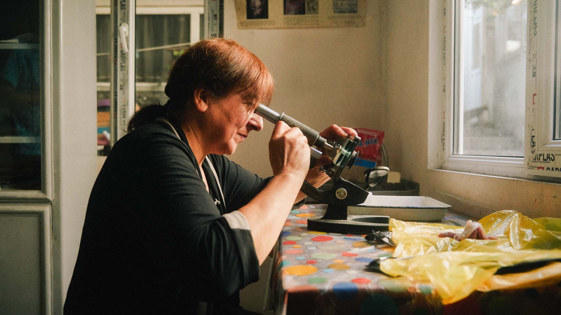 A woman works in a silver making workshop.