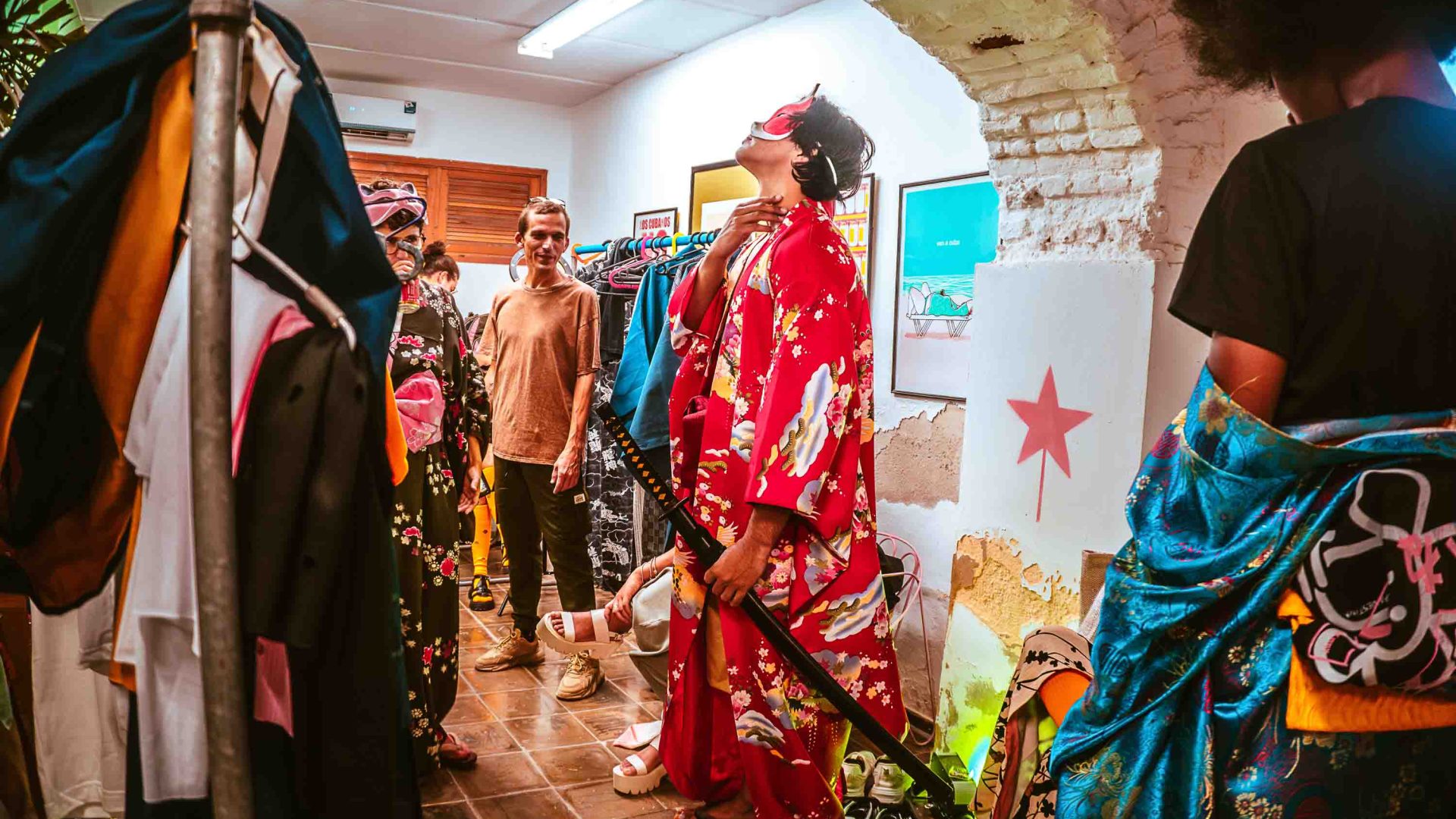 Models backstage in a dressing room.