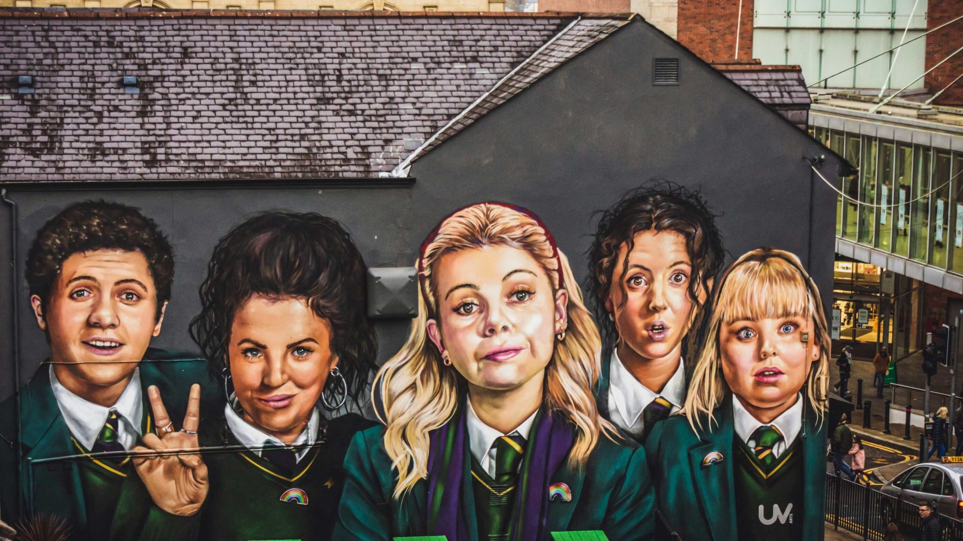 A mural of five girls wearing school uniforms—the main characters of "Derry Girls."