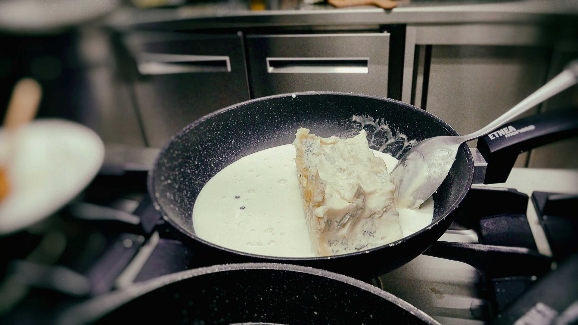 Cuisine blanche being prepared in a pan.