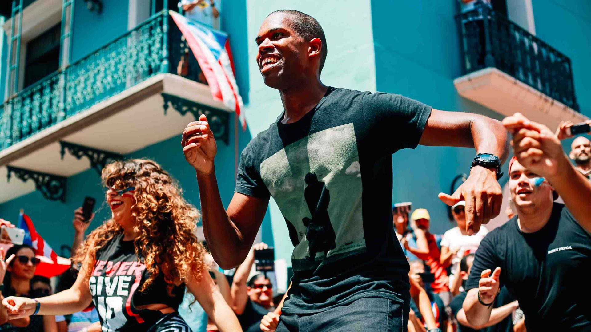 People dance at a street festival