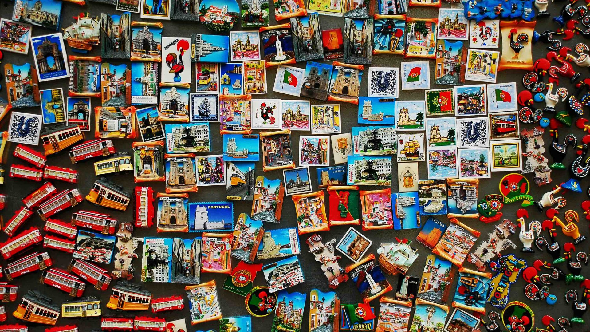 A wall full of cheap plastic souvenir fridge magnets.