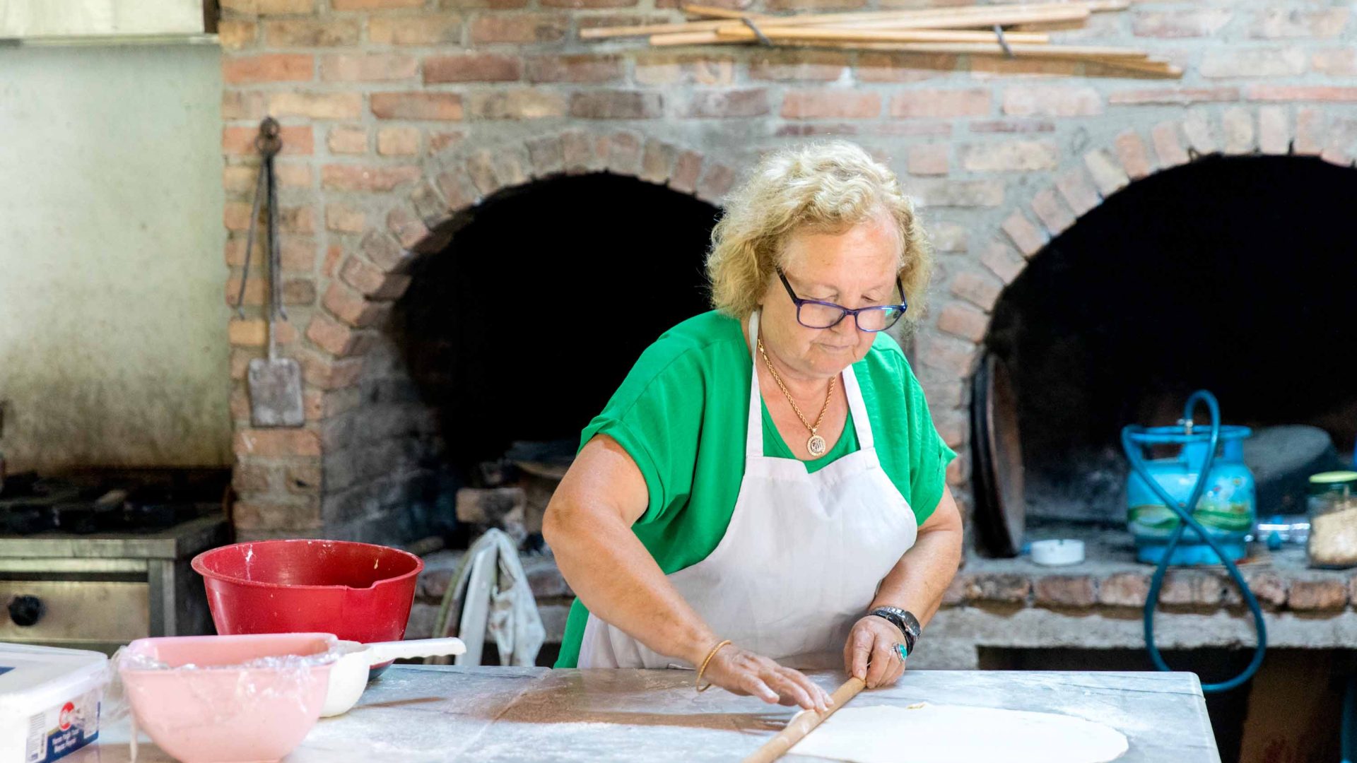 Hatice Mercan from Bizim Ev restaurant prepares food.